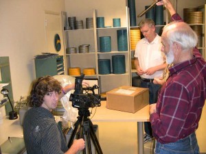 Leigh Mierke and John Zainer film Ed Carter opening KUKAN shipping box.