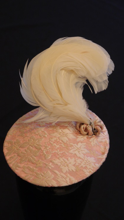 Photo of Nick Savage pink brocade plumed hat owned by Li Ling-Ai