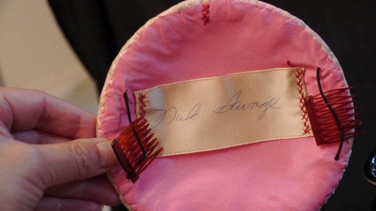 Photo of inside of pink brocade hat