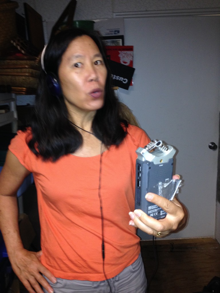 Robin records temporary narration in the sound-proof storage closet at Rubber Stamp Plantation in Honolulu